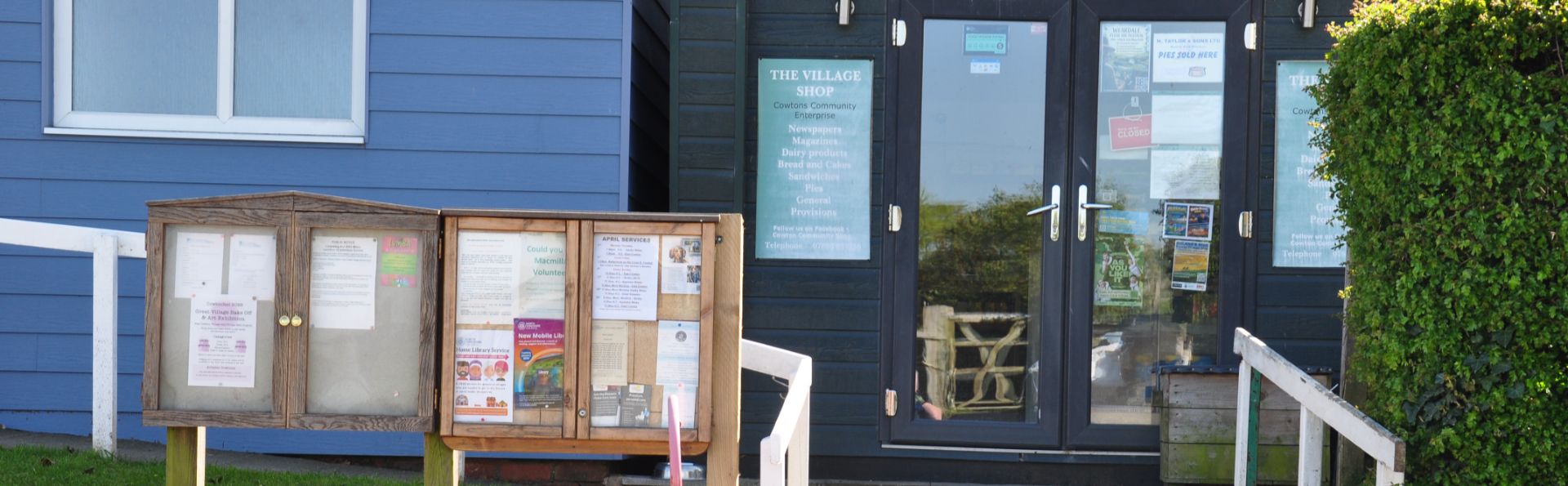 notice boards and front of village hall and village shop